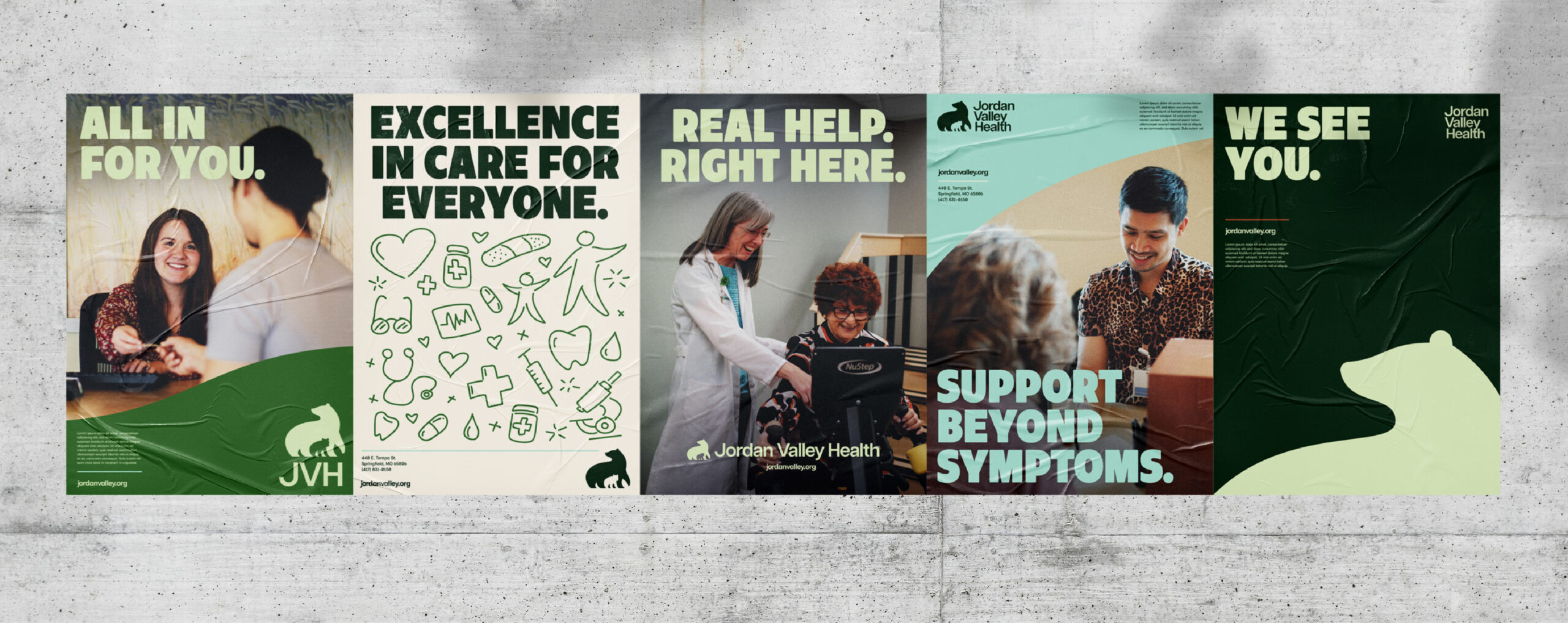 Four posters for Jordan Valley Health feature people smiling, healthcare symbols, and messages: ALL IN FOR YOU, EXCELLENCE IN CARE FOR EVERYONE, SUPPORT BEYOND SYMPTOMS, and WE SEE YOU..